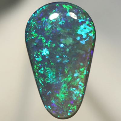 SOLID BLACK OPAL Huge, top quality. With Green and turquoise endlessly sparkling. SEE VIDEO
